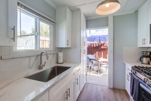 Fridge, microwave, stovetop, coffee/tea maker