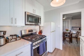 Fridge, microwave, stovetop, coffee/tea maker