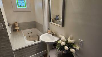 Jetted bath, hair dryer, towels, soap