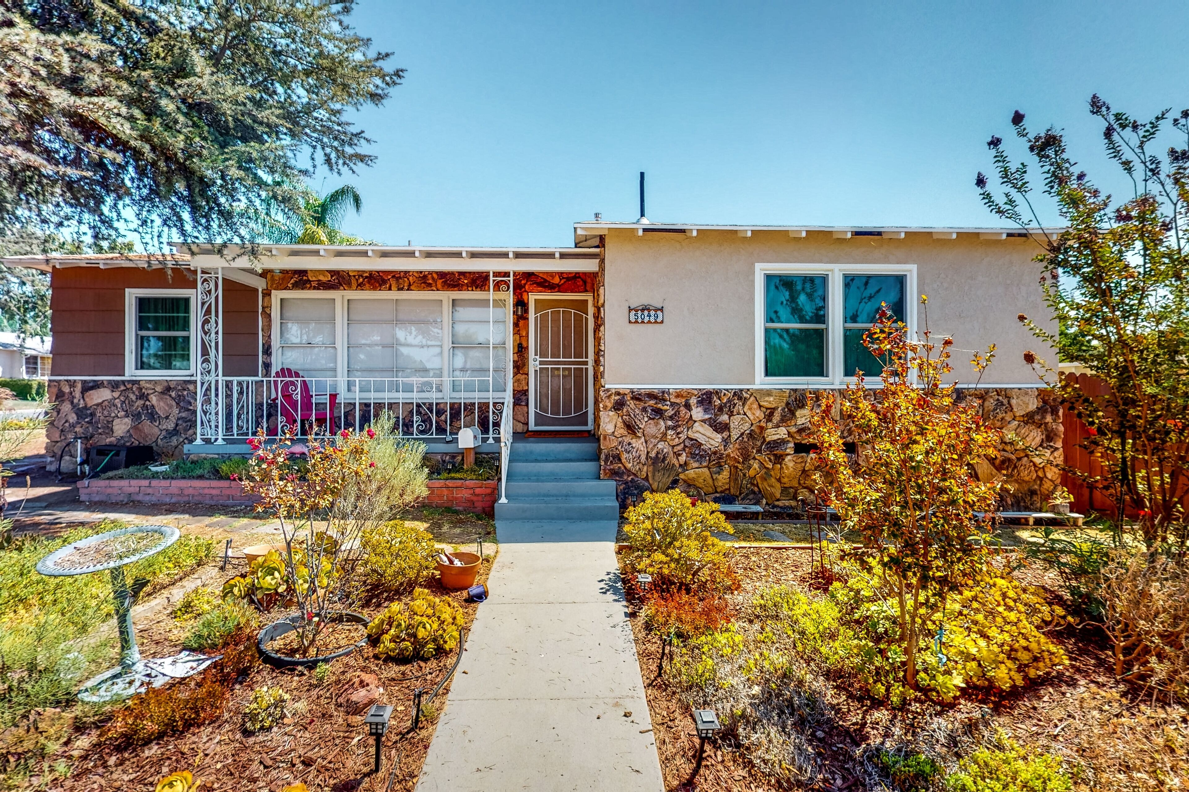 Light-filled property with home & separate studio, enclosed yard, and grill