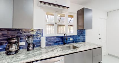 Centrally located condo with full kitchen, AC, W/D, & on-site pool