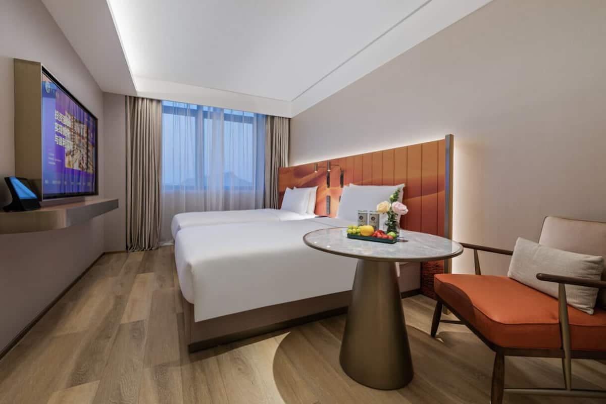 Chambre Confort avec lits jumeaux | Coin séjour | Chauffage par le sol