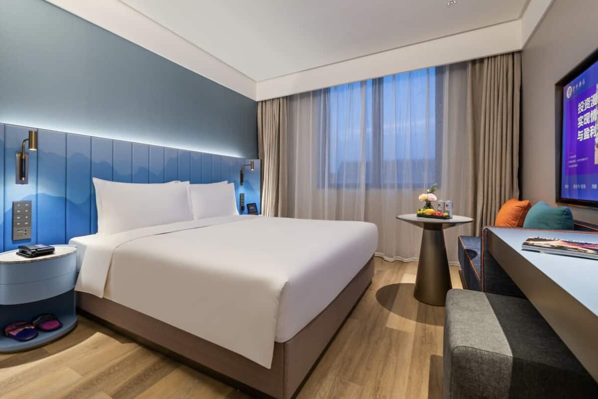 Chambre Double Confort | Coin séjour | Chauffage par le sol