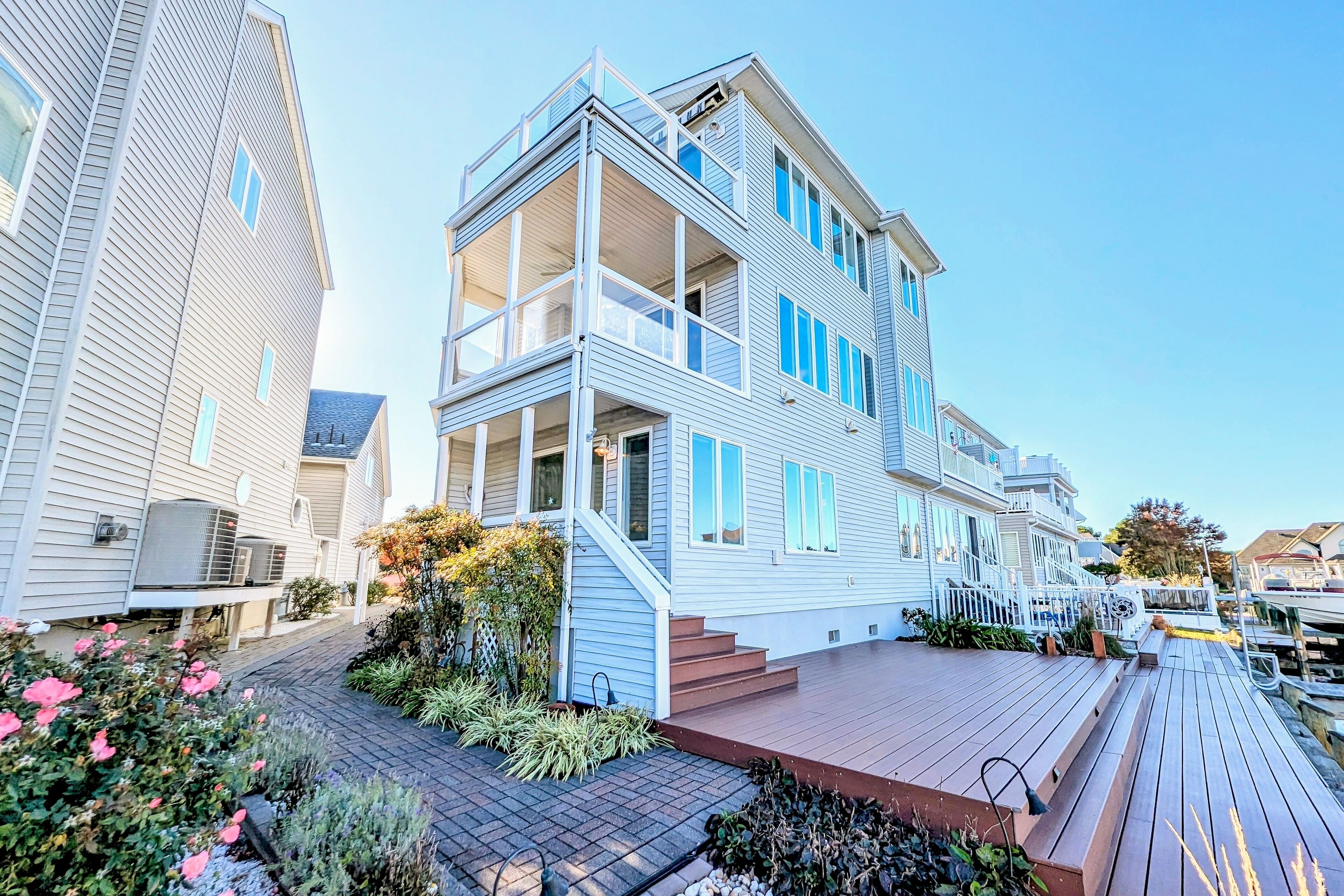 Waterfront home with sunrise/sunset views, chef's kitchen, & outdoor areas