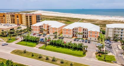 Ground-floor condo next to on-site pool with private patio & beach access