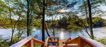 Brand-new riverfront cabin with a open layout, gas grill, and W/D - dog-friendly