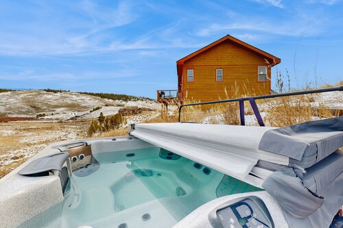 Mountain getaway with hot tub, game room, fireplace, and modern interior