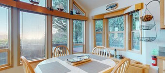 Coastal retreat steps from the beach with a private hot tub & nautical theme