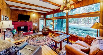 Charming Wallowa Lake home with forest views, fireplace, & private W/D