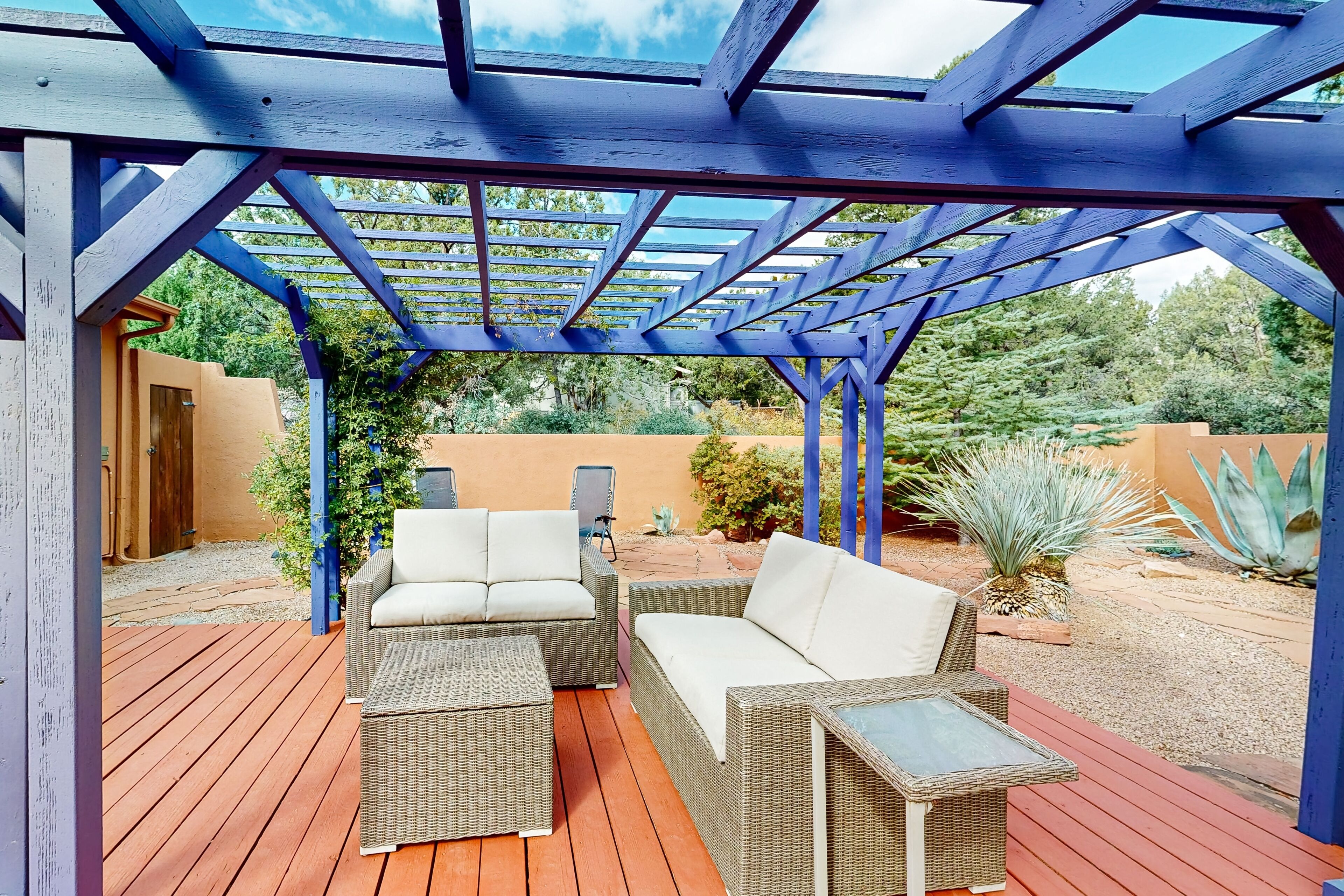 Serene desert home with mountain views, enclosed yard, bright interior, & AC