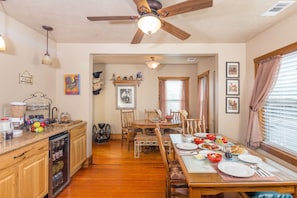 Enjoy meals in the open-plan living and dining area, complete with a dining table and kitchen amenities.