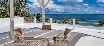 Luxurious beachfront home with private pool, rooftop grill, and sea views