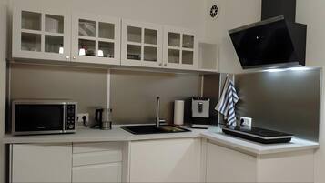 Fridge, microwave, stovetop, coffee/tea maker