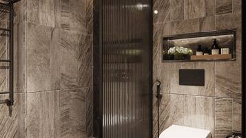 A modern bathroom with a walk-in shower, a toilet, and a shelf with toiletries.