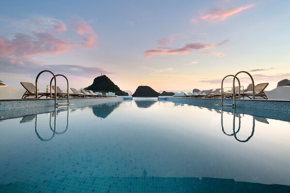 Outdoor pool, pool umbrellas, pool loungers