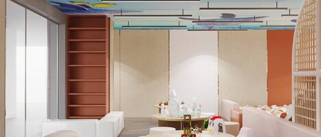A children's playroom with a slide, a small car, and a table with toys.
