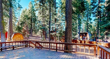 Two-story cabin with a wood fireplace, washer/dryer, & decks