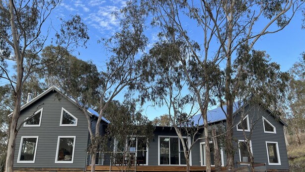 A two-story house with a grey exterior, white trim, and large windows. - Beautiful Country Home.  5 min to Armidale, 10 min to University of New England. (Armidale)
