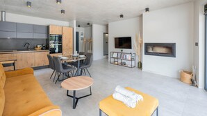 A modern living space with a kitchen, dining area, and seating area. - Stunning home in Pula (Pula)