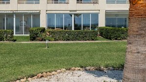 A multi-story hotel with balconies, large windows, and a well-maintained lawn. - Chaparral Seafront by Alfresco Stays (Mijas Costa)