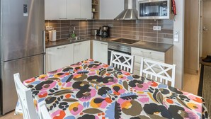 A modern kitchen with stainless steel appliances, a microwave, and a built-in oven.