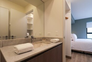 Shower, hair dryer, towels, shampoo