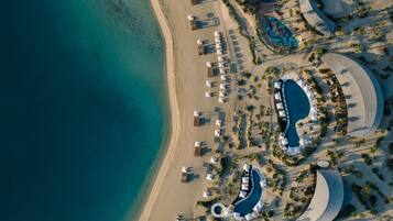 2 outdoor pools, open 9:00 AM to 6:00 PM, pool umbrellas, pool loungers