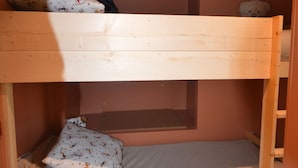 A bunk bed with a pillow and a teddy bear on the top bunk. - Renovated studio at the foot of the slopes with balcony and equipped kitchen (La Plagne Montalbert)