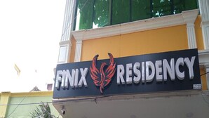 A building with a sign that reads "FINIX RESIDENCY". - Finix Residency (Puducherry)