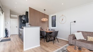 A modern living space with a kitchen, dining area, and seating area. - 2 bedroom nice home in Voorthuizen (Voorthuizen)