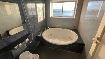 Signature Suite | Bathroom | Separate bathtub and shower, rainfall showerhead, free toiletries