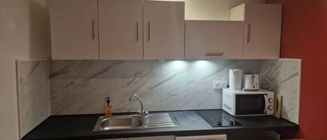 Fridge, microwave, stovetop, coffee/tea maker