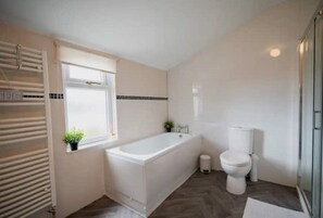 Shower, hair dryer, towels, soap