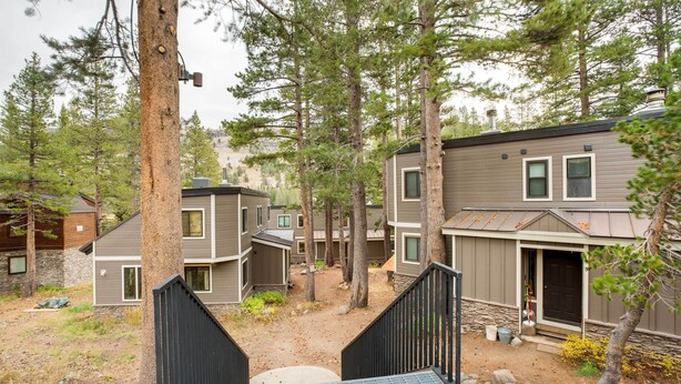 A residential area with multiple houses, a dirt path, and a staircase leading to a house. - Mountain Condo w/ Fireplace in Kirkwood Ski Resort (Kirkwood)