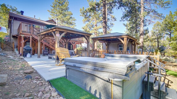 A wooden cabin with a hot tub, a deck, and a covered area. - 1 Mi to Lake: Home w/ Hot Tub & Gazebo in Big Bear (Big Bear Lake)