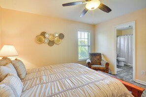 A bedroom with a bed, a chair, a ceiling fan, and a window. - Central High Point Home < 1 Mi to Downtown! (High Point)