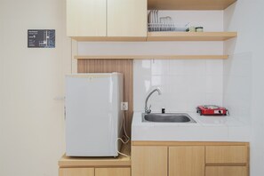 Apartamento | Cocina privada | Frigorífico grande y placa de cocina