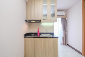 Apartment | Private kitchen | Full-sized fridge, stovetop - Homey And Nice 2Br At Cinere Resort Apartment (Depok)