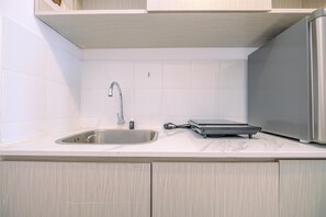 Enjoy cooking in this well-equipped kitchen with a stainless steel sink and dishwasher.