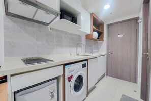 Studio | Private kitchen | Full-sized fridge, stovetop - Compact And Homey Studio Tamansari Bintaro Mansion Apartment (South Tangerang)