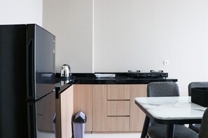Apartment | Private kitchen | Full-size fridge, stovetop - Modern And Compact Designed 1Br At Ciputra International Apartment (Jakarta)