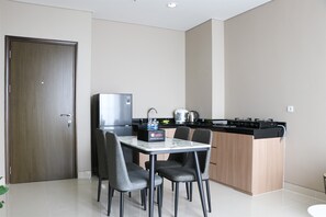 Apartment | Private kitchen | Full-size fridge, stovetop - Modern And Compact Designed 1Br At Ciputra International Apartment (Jakarta)