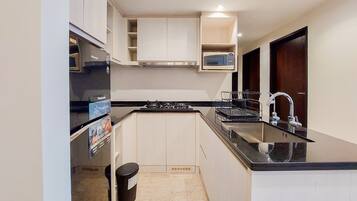 Apartment | Private kitchen | Full-size fridge, stovetop