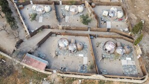 An aerial view of a property with multiple spherical structures, possibly for accommodation or events, surrounded by a landscaped area with pathways and sparse vegetation. - Hotel Zielo de Levante (Tirig)