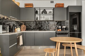 Fridge, microwave, oven, stovetop - Stylish, Light and Bright Apartment at The Signature (Cape Town)