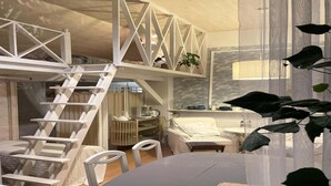 A compact, well-lit room with a loft bed, a ladder, a small table, and a chair. - Comfortable holiday home in the countryside, pool (Rozewko)