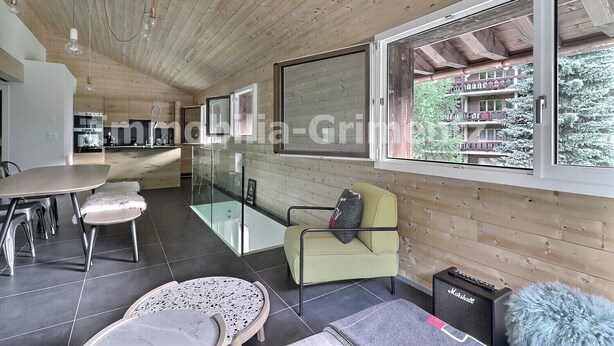 A modern interior with a dining area, kitchen, and seating space with a view. - Comfortable flat on 2 levels for 4 to 6 people, living room with 1 double divan bed, kitchen area wi (Grimentz)