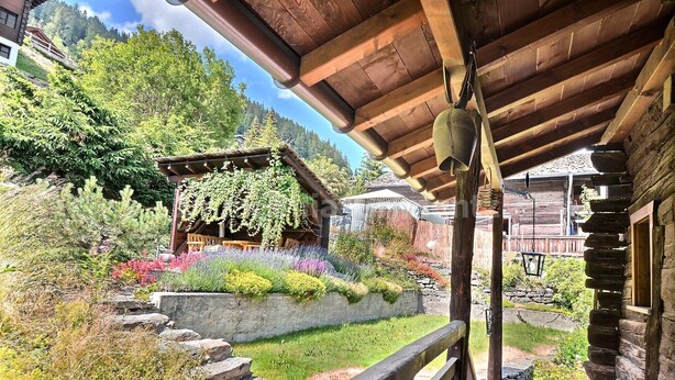 A rustic wooden cabin with a stone pathway leading to a wooden deck. - Comfortable flat on 2 levels for 3 to 4 people, living room, kitchen area, 1 double bedroom (140), 1 (Grimentz)