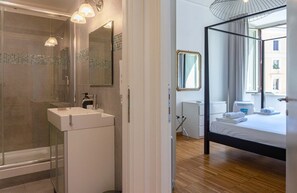 Shower, hair dryer, towels, toilet paper