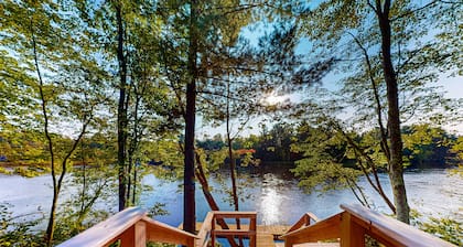 New dog-friendly cabin with river views, grill, modern interior, W/D, and AC